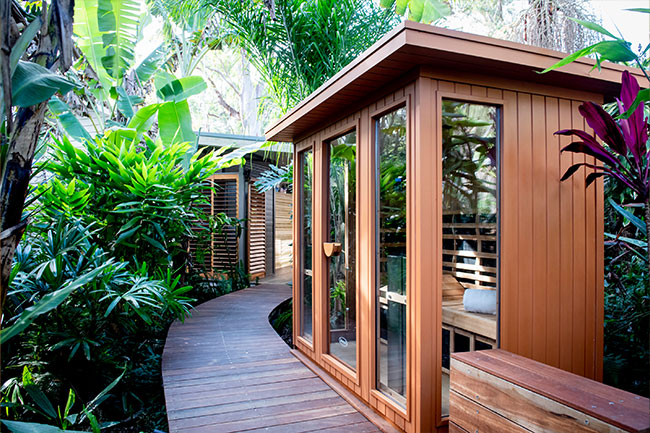 Timber pathway welcomes you to the serene sanctuary of Cloud 9 Sauna